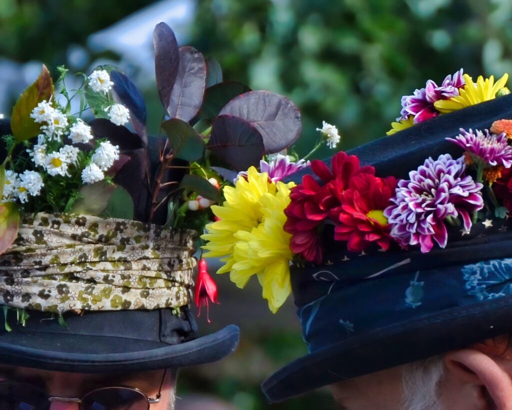 Morris dancer hats featuring brightly coloured flowers