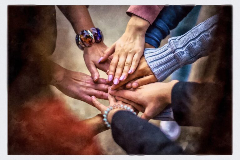 A group of hands touching