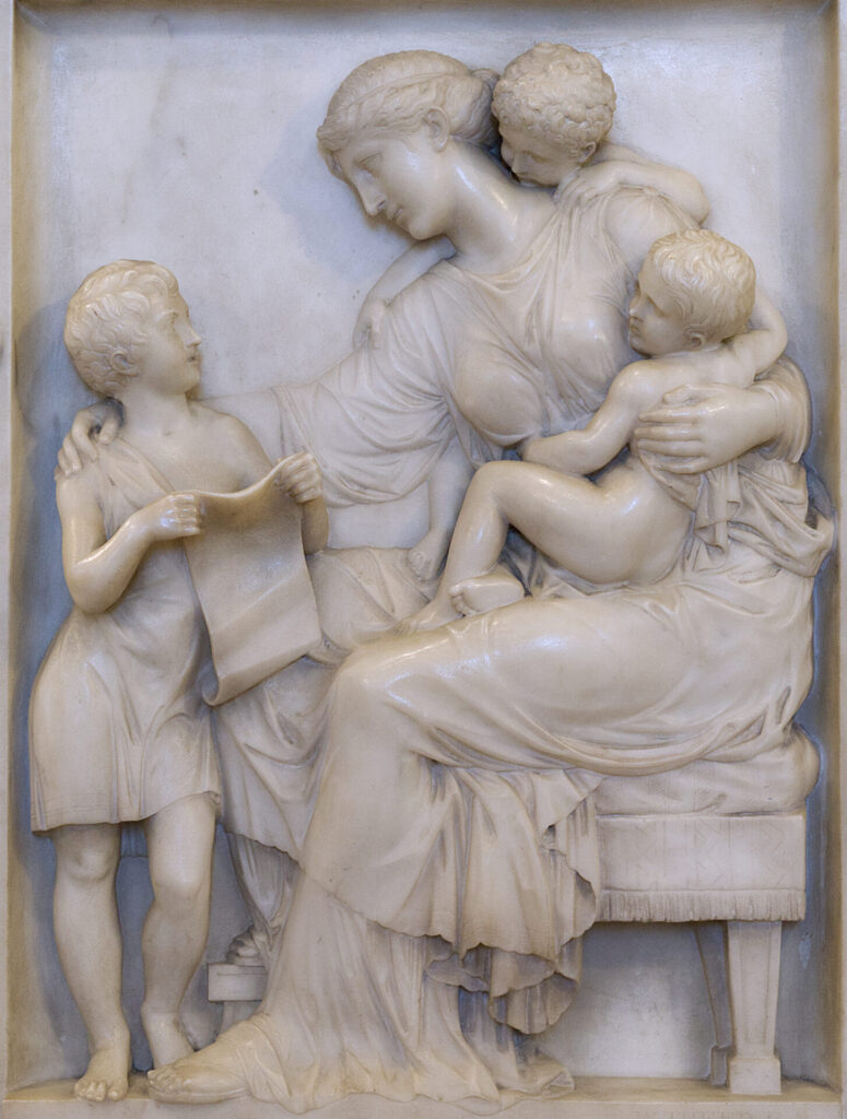 closeup of a frieze of mother and three children